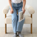 Fauteuil d'appoint en bouclette beige, dossier ouvert incurvé, une place
